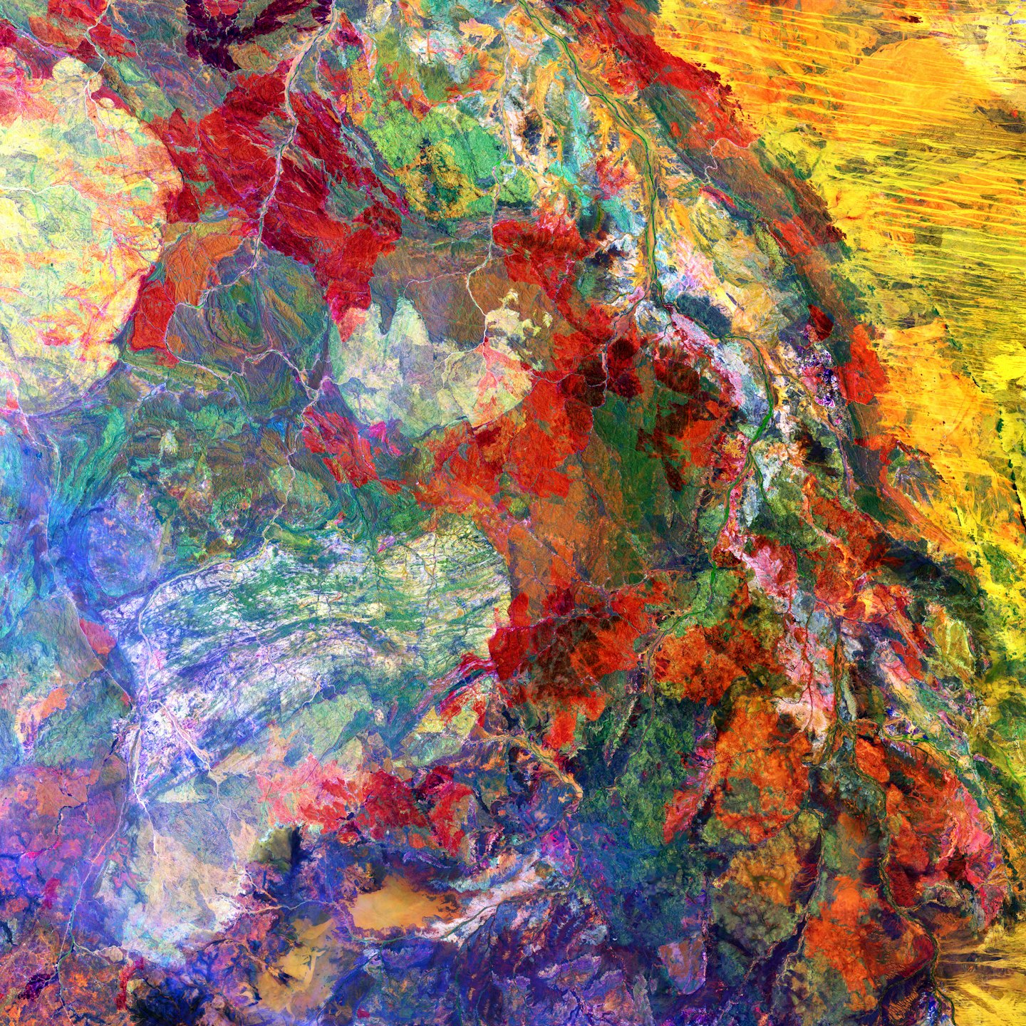 Aerial view of a colorful, textured natural landscape.